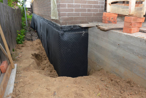 Happy homeowners after waterproofing job in Embarrass